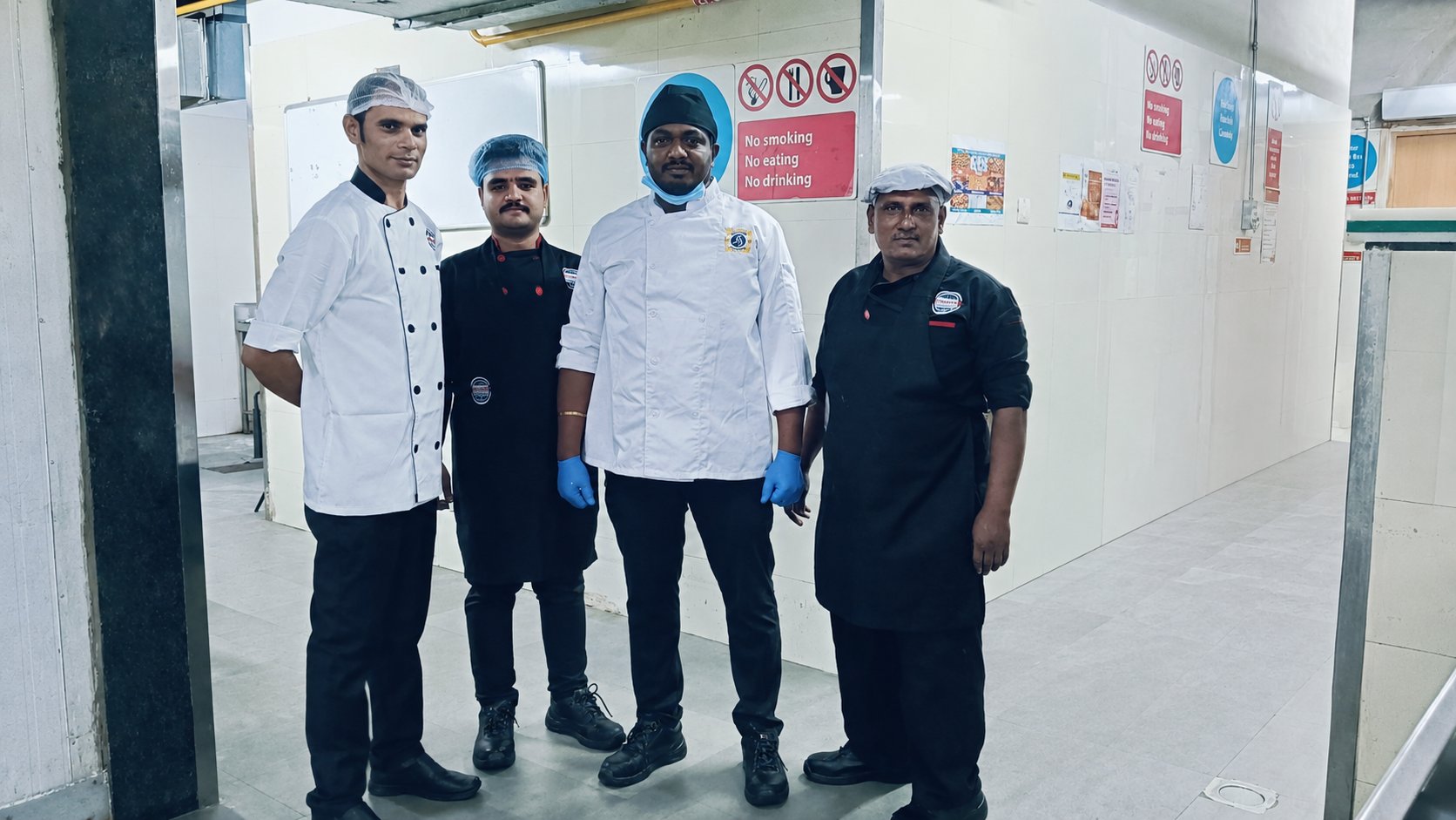 Kitchen team in proper PPE